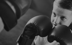 Young boy with boxing gloves on